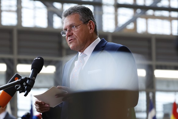 European Commissioner for Trade and Economic Security Maros Sefcovic speaks with the media as he arrives for a meeting of EU trade ministers at the European Council building in Brussels, Thursday, May ...