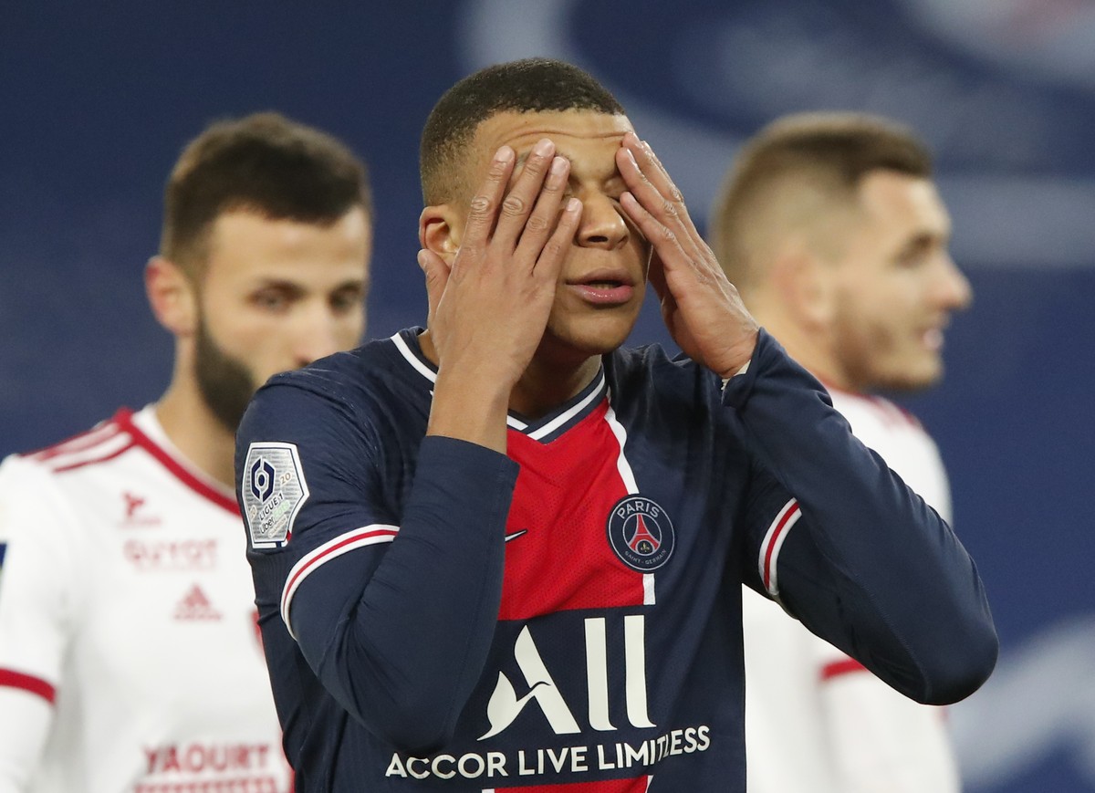 PSG's Kylian Mbappe reacts after missing a chance during the French League One soccer match between Paris Saint-Germain and Brest at the Parc des Princes in Paris, Saturday, Jan. 9, 2021. (AP Pho ...