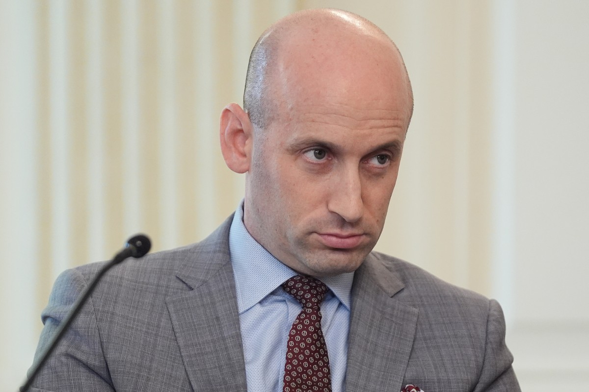 White House deputy chief of staff Stephen Miller listens as President Donald Trump speaks during a roundtable meeting on antifa in the State Dining Room at the White House, Wednesday, Oct. 8, 2025, in ...