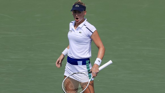 Jil Teichmann, of Switzerland, reacts in her match against Ashleigh Barty, of Australia, during the women's single final of the Western &amp; Southern Open tennis tournament Sunday, Aug. 22, 2021, in Mason, Ohio. (AP Photo/Aaron Doster)