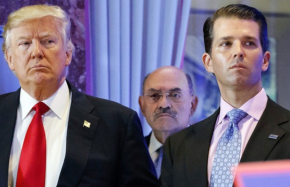 FILE - President-elect Donald Trump, left, his chief financial officer Allen Weisselberg, center, and his son Donald Trump Jr., right, attend a news conference at Trump Tower in New York, on January 11...