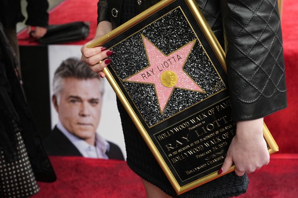 The late actor Ray Liotta&#039;s daughter Karsen holds a replica of a posthumous star for her father following a ceremony for him on the Hollywood Walk of Fame, Friday, Feb. 24, 2023, in Los Angeles.  ...
