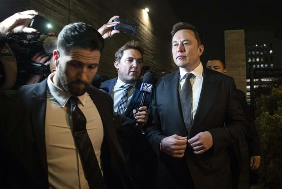 epaselect epa08042645 Tesla and SpaceX CEO Elon Musk (R) leaves after the first day of a trial against British diver Vernon Unsworth at the United States Courthouse in Los Angeles, California, USA, 03 ...
