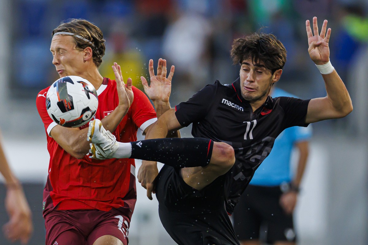 Switzerland's Silvan Wallner, left, fights for the ball with Albania's Stiven Shpendi, right, during the Under 21 UEFA Euro 2025 Qualifying Group E soccer match between Switzerland and Alban ...