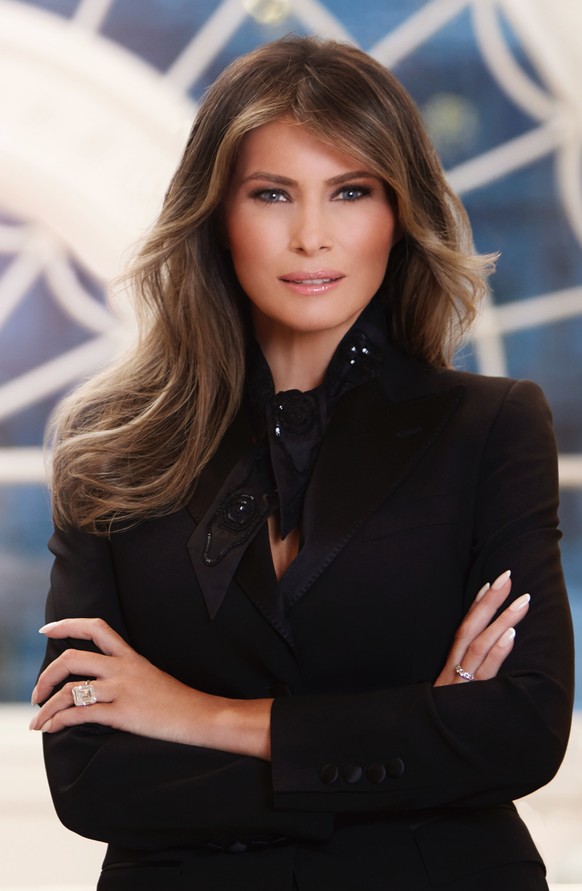 In this photo provided by the White House, first lady Melania Trump in her first official portrait as the first lady as photographed in her new residence at the White House in Washington. (The White H ...