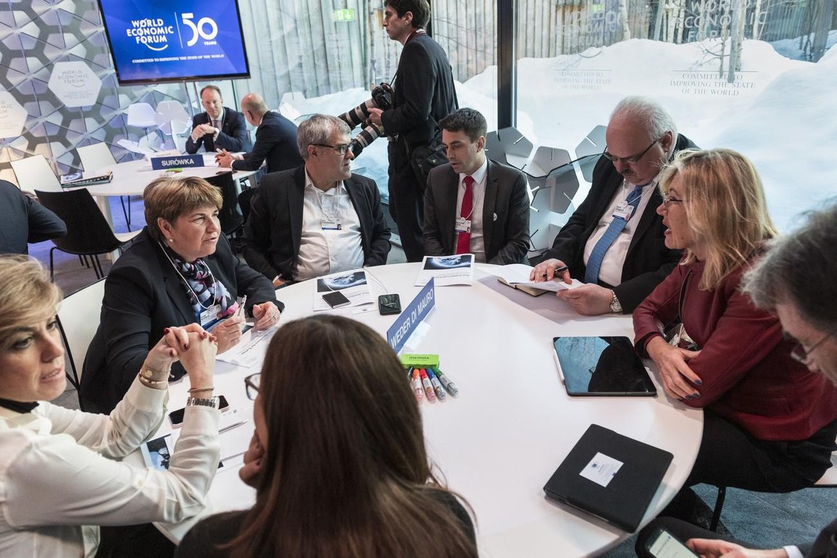 Federal councillor Viola Amherd, Swiss minister of defense, 2nd left, speaks with Swiss Beatrice Weder di Mauro, President of Centre for Economic Policy Research UK, right, ahead of a panel session, d ...