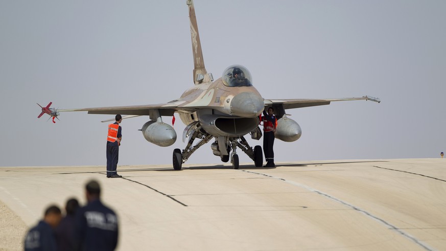 FILE - In this Monday, Nov 25, 2013, file photo, technicians inspect an Israeli air force F-16 jet at the Ovda airbase near Eilat, southern Israel. The Israeli military says it has shot down an Irania ...