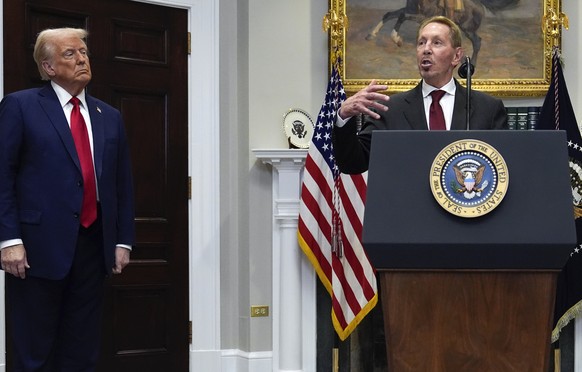 Larry Ellison, chairman of Oracle Corporation, center, speaks as President Donald Trump, left, and Masayoshi Son, SoftBank Group CEO, listen in the Roosevelt Room at the White House, Tuesday, Jan. 21, ...