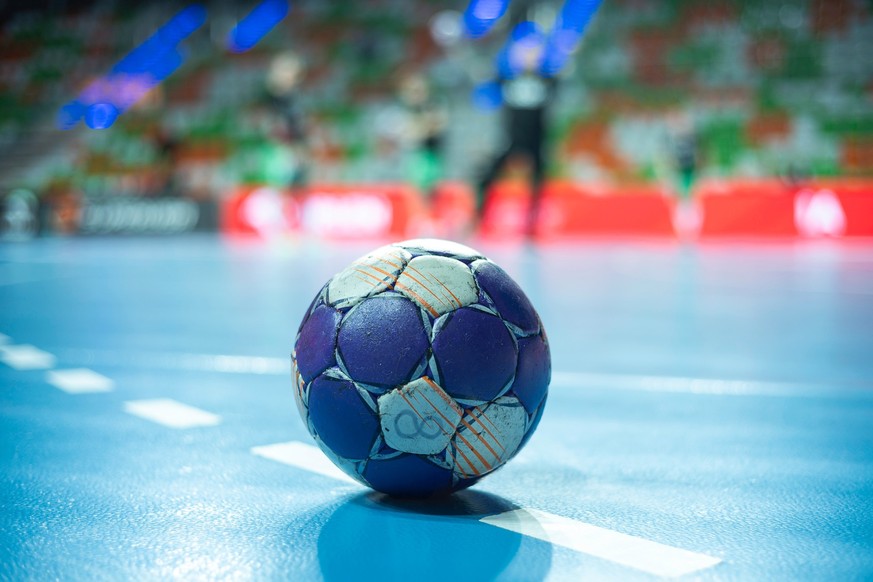 Handball - a ball laying on the 9 meters dotted line.