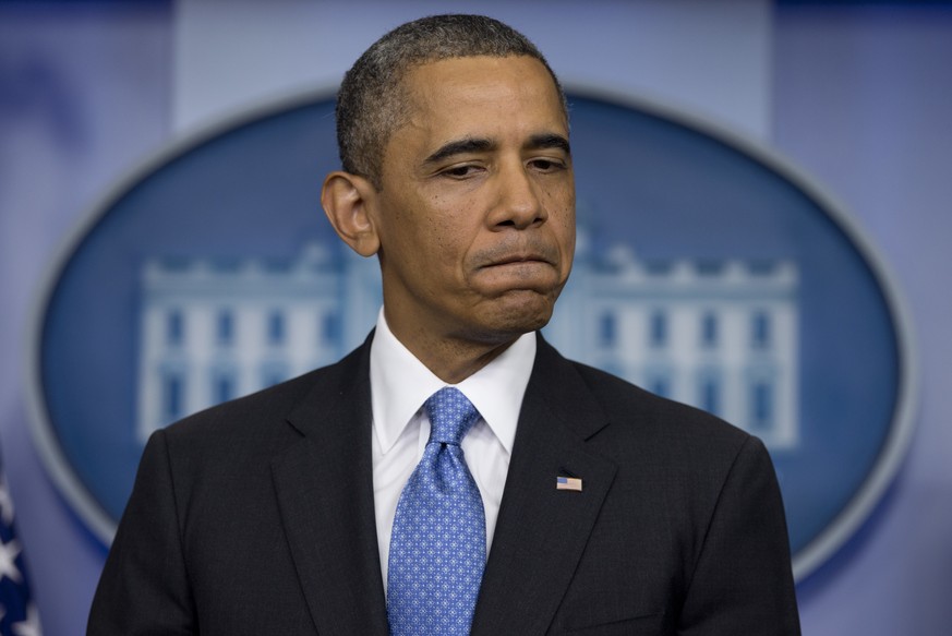 FILE - In this Friday, July 19, 2013 file photo, President Barack Obama pauses as he speaks about the fatal shooting of Trayvon Martin by George Zimmerman, during the daily news briefing at the White  ...