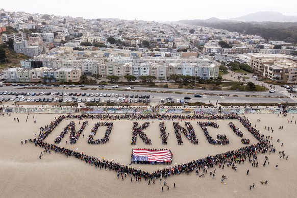 People form a human banner at Ocean Beach during the &quot;No Kings&quot; protests in San Francisco on Saturday, June 14, 2025. (Santiago Mejia/San Francisco Chronicle via AP)
APTOPIX US Protests San  ...
