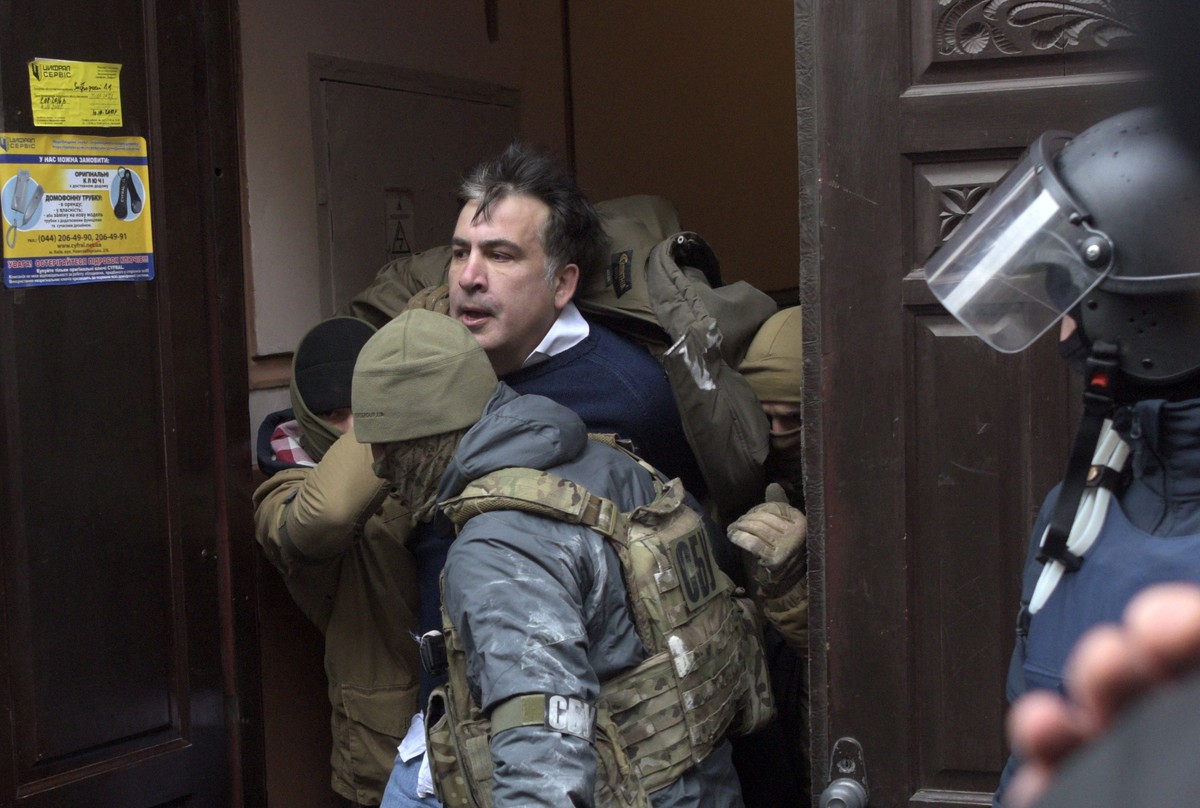 The Ukrainian Security Service officers detain Mikheil Saakashvili at the entrance of his house in Kiev, Ukraine, Tuesday, Dec. 5, 2017. Ukraine's prosecutor-general announced late Friday, Dec. 8 ...