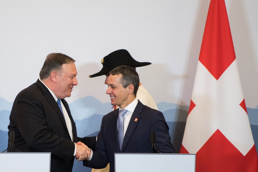 U.S. Secretary of State Mike Pompeo, left, and Swiss foreign minister Ignazio Cassis, right, shake hands at presse conference during Pompeo&#039;s visit to Switzerland, on Sunday, 2 June 2019, at the  ...