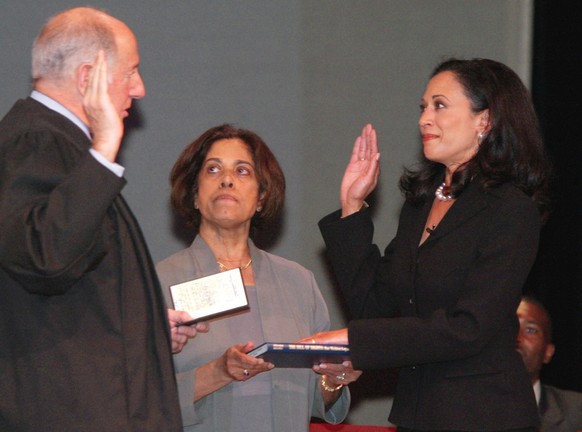 San Francisco&#039;s new district attorney, Kamala Harris, right, receives the oath of office from California Supreme Court Chief Justice Ronald M. George, left, during inauguration ceremonies Thursda ...