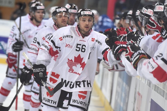 epa05688927 Canadas scorer Maxim Noreau celebrates after scoring 1-2, during the game between HK Dinamo Minsk and Team Canada at the 90th Spengler Cup ice hockey tournament in Davos, Switzerland, Mond ...