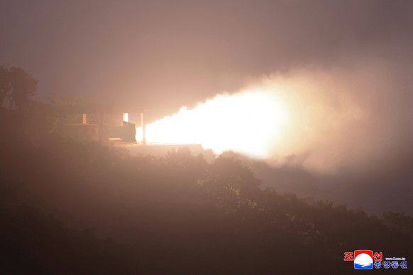 epa12363403 A photo released by the official North Korean Central News Agency (KCNA) shows North Korea conducting a ground jet test of high-thrust solid-fuel engine using composite carbon fiber materi ...