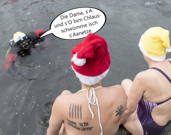 Bei Temperaturen um die 1 Grad Celsius stuerzen sich wagemutige Teilnehmer des 18. Samichlaus-Schwimmens in das kalte Wasser der Limmat, aufgenommen am Sonntag, 3. Dezember 2017, in Zuerich. (KEYSTONE ...