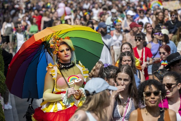 epa10683825 People walk through the streets for the rights of the LGBTQIA+ community, during the Geneva Pride march, in Geneva, Switzerland, 10 June 2023. EPA/MARTIAL TREZZINI