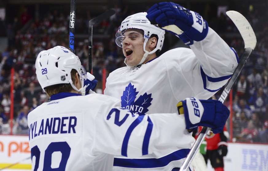 FILE - In this Oct. 12, 2016, file photo, Toronto Maple Leafs center Auston Matthews, right, celebrates a goal against the Ottawa Senators with teammate William Nylander during an NHL hockey game in O ...
