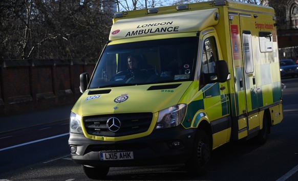 epa09719489 A National Health Service (NHS) ambulance outside St. Thomas Hospital in London, Britain 31 January 2022. Britain&#039;s Ministers are expected to decide whether or not to scrap mandatory  ...
