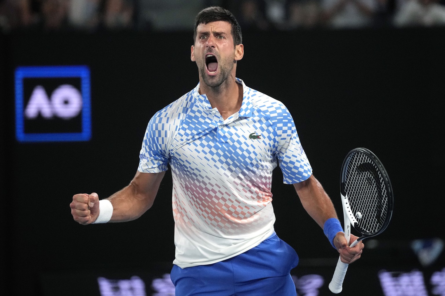 Novak Djokovic of Serbia reacts during his quarterfinal against Andrey Rublev of Russia at the Australian Open tennis championship in Melbourne, Australia, Wednesday, Jan. 25, 2023. (AP Photo/Dita Ala ...