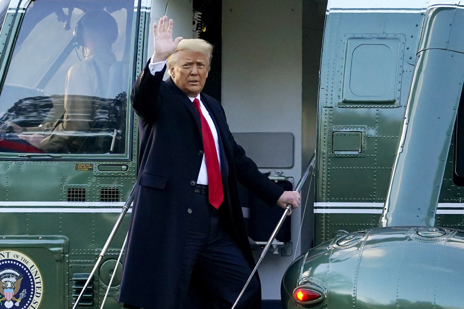 FILE - In this Wednesday, Jan. 20, 2021, file photo, President Donald Trump waves as he boards Marine One on the South Lawn of the White House, in Washington, en route to his Mar-a-Lago Florida Resort ...