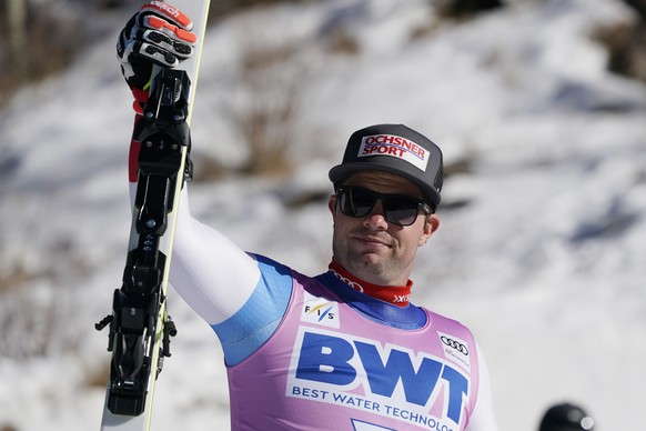 Switzerland's Beat Feuz celebrates a third place finish in a men's World Cup downhill ski race Saturday, Dec. 4, 2021, in Beaver Creek, Colo. (AP Photo/Gregory Bull)