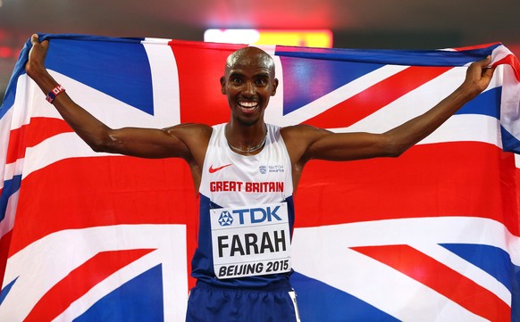 BEIJING, CHINA - AUGUST 29: Mohamed Farah of Great Britain celebrates after crossing the finish line to win gold in the Men's 5000 metres final during day eight of the 15th IAAF World Athletics Champi ...