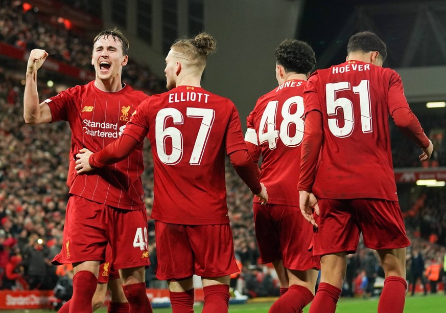 Football - 2019 / 2020 Emirates FA Cup - Fourth Round, Replay: Liverpool vs. Shrewsbury Town Liverpool s players celebrate their sides first goal, an own goal by Shrewsbury Town s Ro-Shaun Williams, a ...