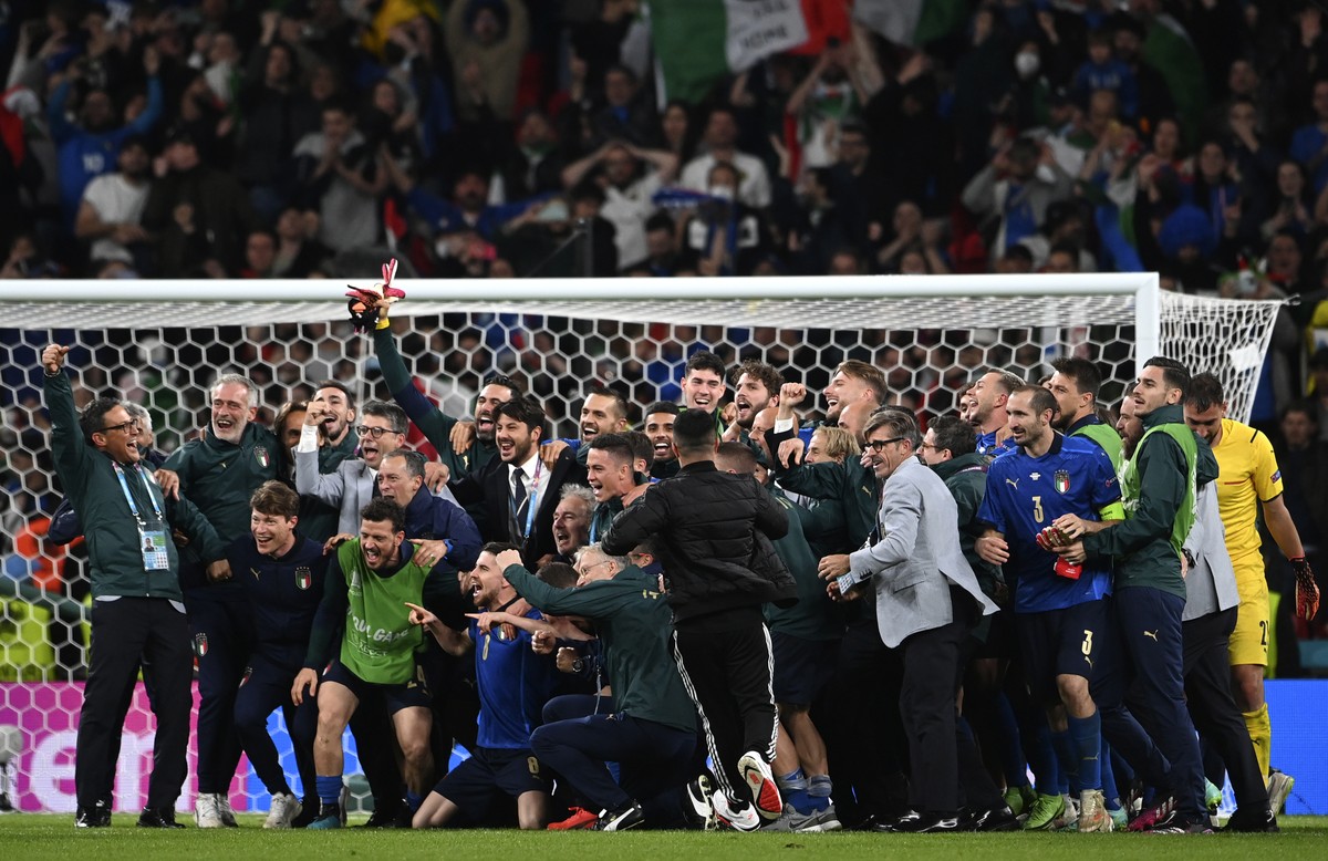 Italy's team celebrate after winning the Euro 2020 soccer championship semifinal match between Italy and Spain at Wembley Stadium in London, Tuesday, July 6, 2021. (Andy Rain/Pool via AP)