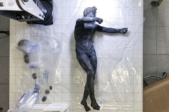 epa10294010 An undated handout photo made available by the Italian Ministry of Culture press office shows one of the twenty-four bronze statues, of the Roman Etruscan age discovered in San Casciano de ...