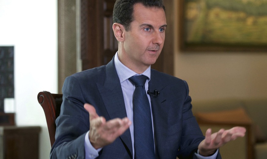 FILE - In this Wednesday, Sept. 21, 2016 photo released by the Syrian Presidency, Syrian President Bashar Assad speaks to The Associated Press at the presidential palace in Damascus, Syria. The House  ...