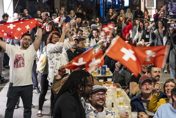 epa11334443 Supporters of singer Nemo, finalist of the 68th Eurovision Song Contest ESC, celebrate during a public viewing watching the broadcast of the ESC finals as Nemo is declared winner of the co ...