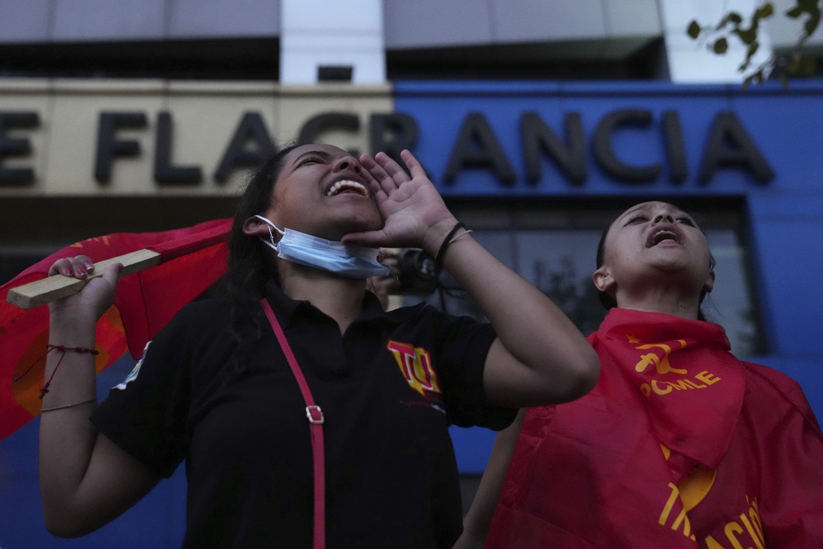 Protesters shout outside the Flagrancia Unit of the Prosecutor's Office during a protest demanding the freedom of Indigenous leader Leonidas Iza who was arrested at dawn after calling for protest ...