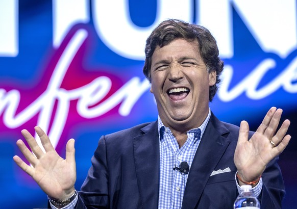 epa10748602 American conservative political commentator Tucker Swanson McNear Carlson speaks during the Turning Point Action Conference in West Palm Beach, Florida, USA, 15 July 2023. Turning Point Ac ...