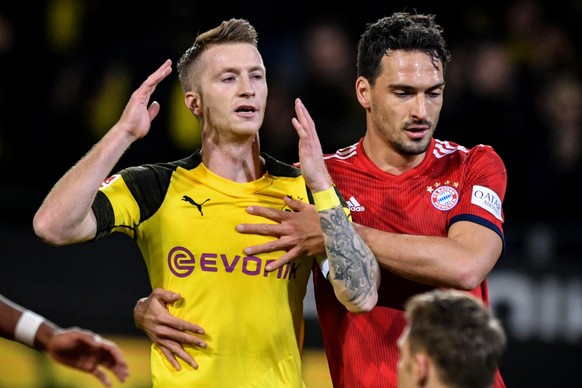 epa07657803 (FILE) - Dortmund&#039;s Marco Reus (L) and Bayern&#039;s Mats Hummels (R) during the German Bundesliga soccer match between Borussia Dortmund and FC Bayern Muenchen in Dortmund, Germany,  ...