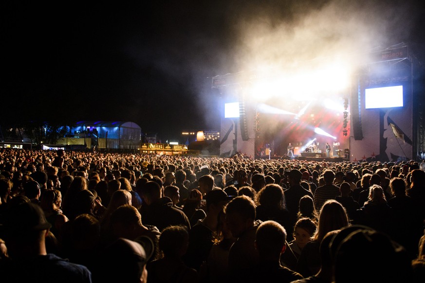 epa05504499 Festivalgoers cheer at the music festival Open Air Gampel, in Gampel, Switzerland, 20 August 2016 (issued 21 August). The annual festival runs from 18 to 21 August. EPA/MANUEL LOPEZ