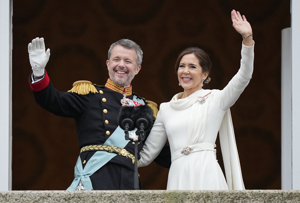 FILE - Denmark's King Frederik X and Denmark's Queen Mary wave from the balcony of Christiansborg Palace in Copenhagen, Denmark, Sunday, Jan. 14, 2024. Denmark's new King Frederik X who ...