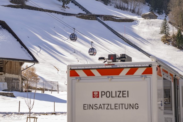 epa12830210 Police vehicles are parked at the valley station of the Titlis cable cars of the Engelberg-Titlis Express gondola lift, after a gondola of the same lift crashed on Truebsee, in Engelberg,  ...