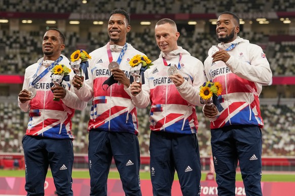 FILE - Silver medalist, team Britain, from left, Chijindu Ujah, Zharnel Hughes, Richard Kilty and Nethaneel Mitchell-Blake pose, during the medal ceremony for the men&#039;s 4 x 100-meter relay at the ...