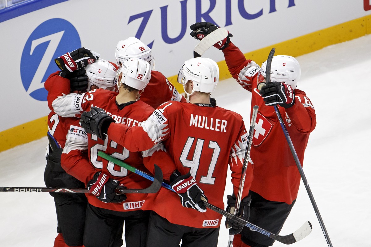 Switzerland's forward Joel Vermin, left, celebrates his goal with teammates forward Nino Niederreiter #22, forward Timo Meier #28, defender Mirco Mueller #41 and defender Raphael Diaz, right, aft ...