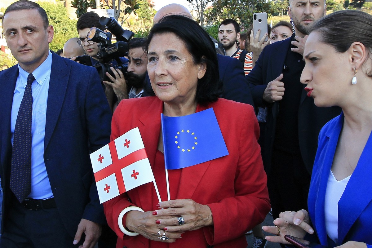 FILE - Georgian President Salome Zourabichvili, center, attends a public rally in support of Georgia's EU aspirations in Tbilisi, Georgia, on June 16, 2022. The party that dominates the parliamen ...