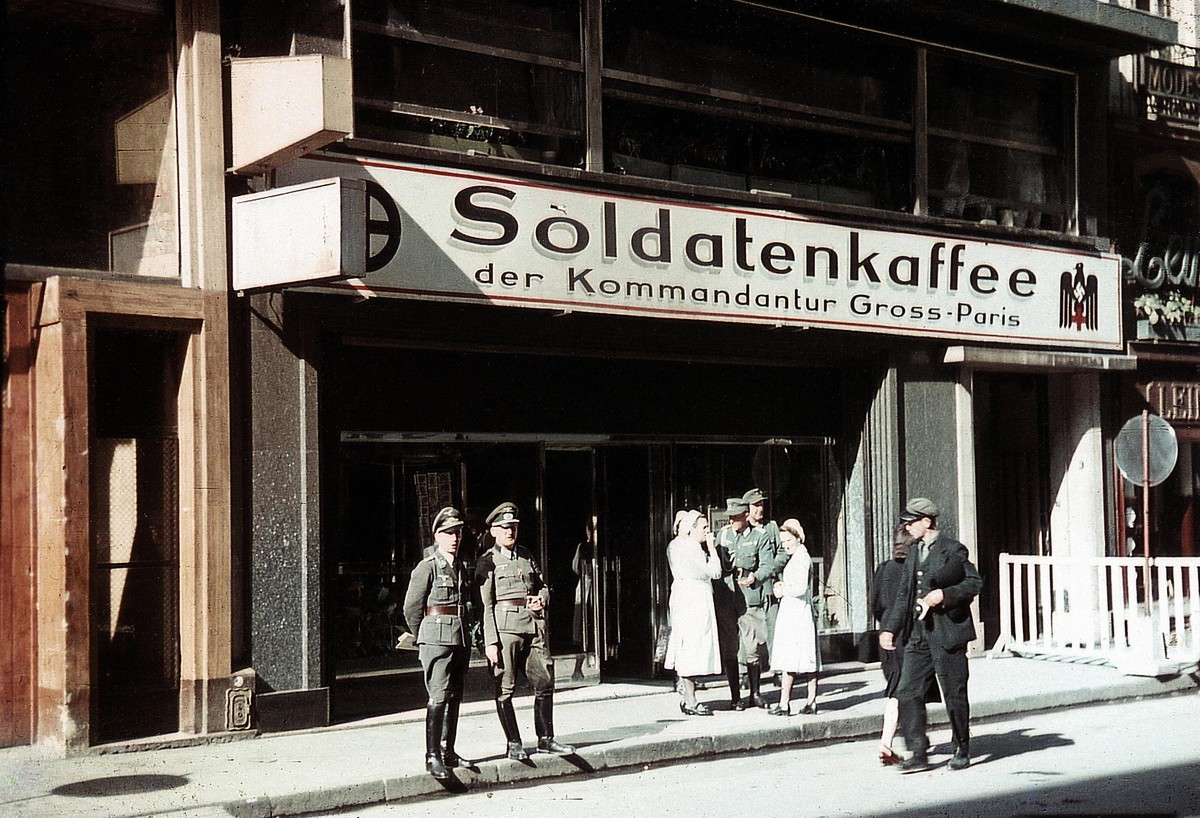 German Wehrmacht soldiers in front of the Soldatenkaffee der Kommandantur Gross-Paris (Soldiers' Coffee House of the Greater Paris Command), Paris, 1943. The cafe is one of many reserved for Germ ...