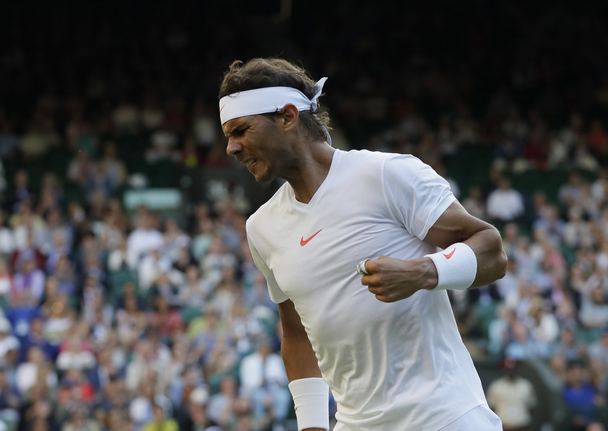 Rafael Nadal of Spain celebrates winning a point from Juan Martin Del Potro of Argentina during their men's quarterfinal match at the Wimbledon Tennis Championships in London, Wednesday July 11,  ...