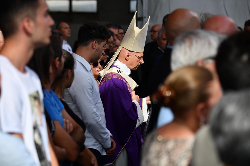 epa07772593 Archbishop of Genoa, Italian cardinal Angelo Bagnasco during a memorial ceremony for the victims on the first anniversary of the Morandi highway bridge collapse, in Genoa, northern Italy,  ...