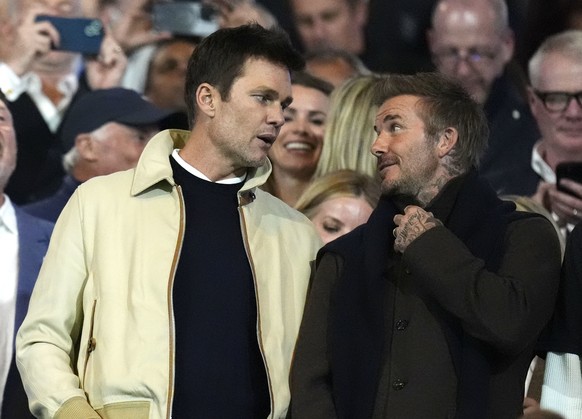 Birmingham City co-owner Tom Brady, left, talks with Inter Miami co-owner David Beckham in the stands before a Sky Bet League One soccer match in Birmingham, England, Monday Sept. 16, 2024. (Nick Pott ...