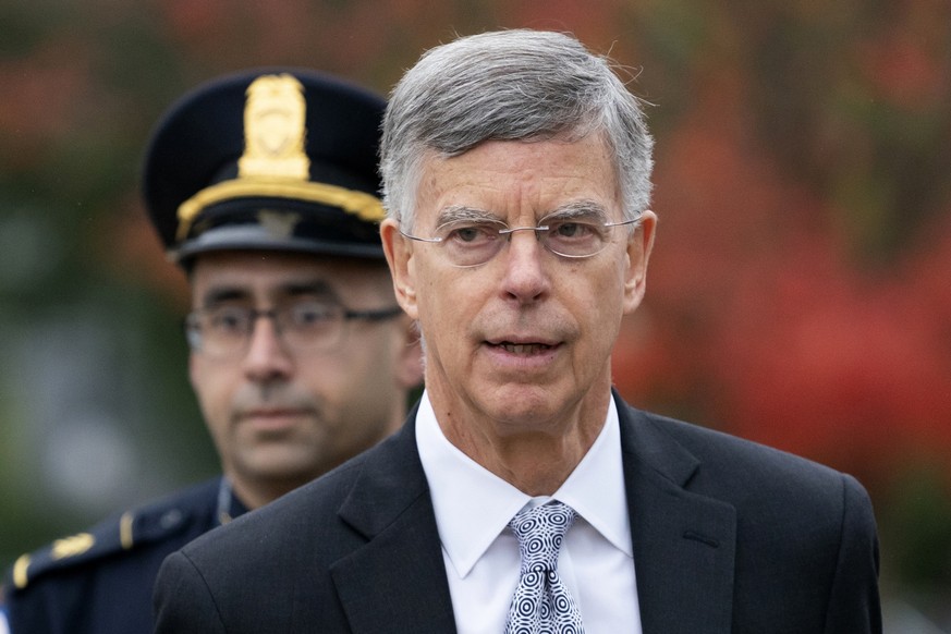 FILE - In this Oct. 22, 2019, file photo, Ambassador William Taylor is escorted by U.S. Capitol Police as he arrives to testify before House committees as part of the Democrats&#039; impeachment inves ...