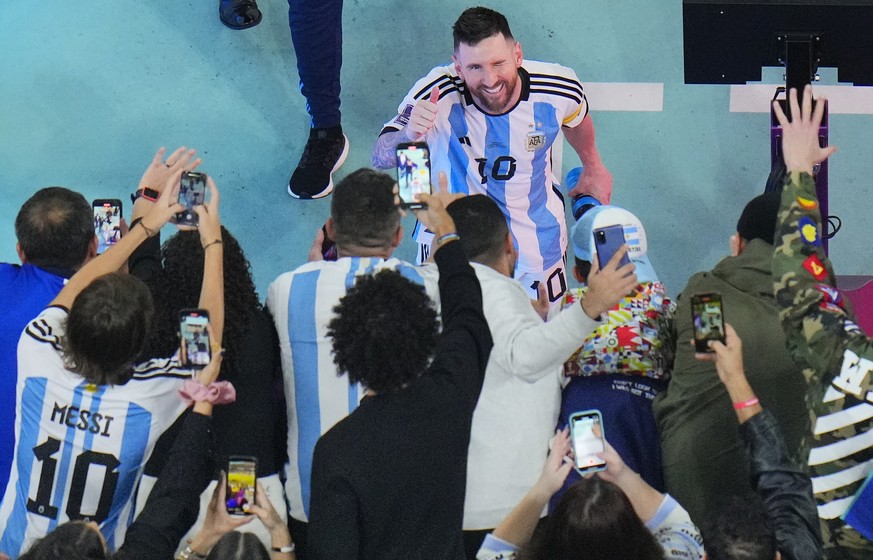 Argentina&#039;s Lionel Messi greets cheering fans after his team&#039;s 3-0 win in the World Cup semifinal soccer match between Argentina and Croatia at the Lusail Stadium in Lusail, Qatar, Wednesday ...