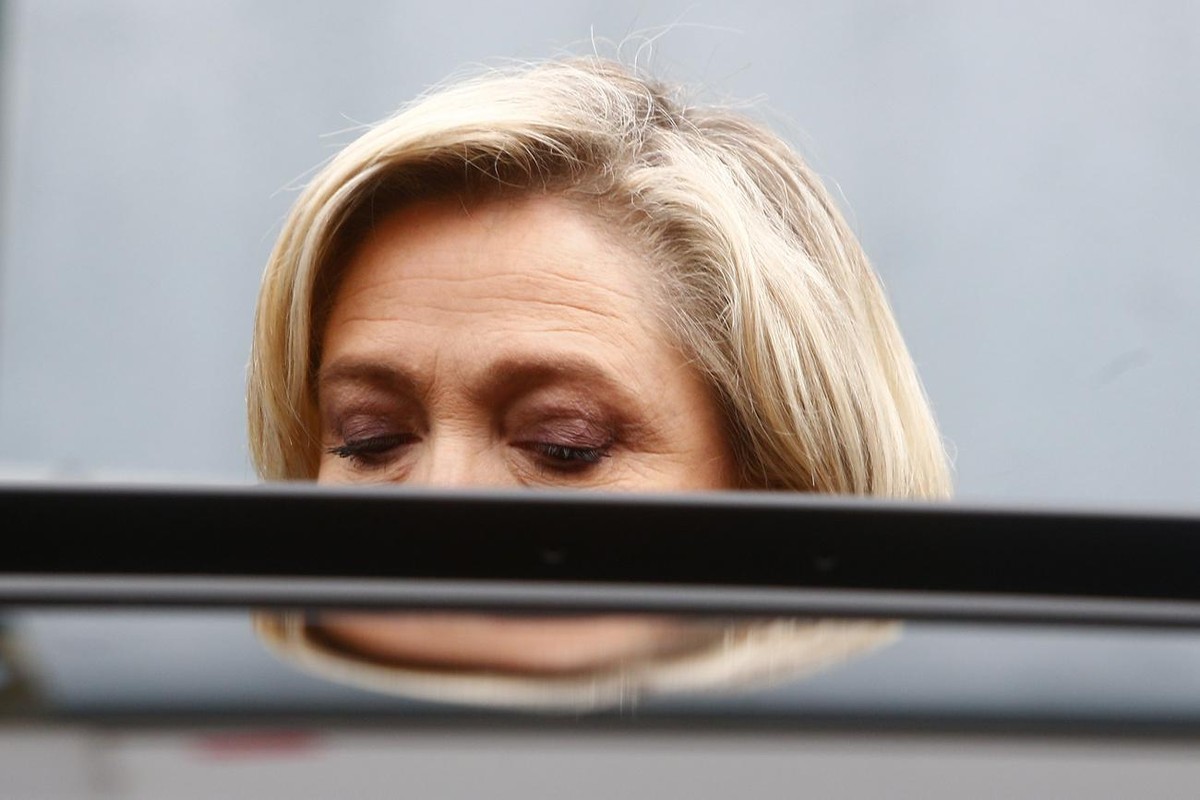 Far-right leader Marine Le Pen enters her car after voting for the regional elections in Henin-Beaumont, northern France, Sunday, June 27, 2021. A decisive, second round of voting in regional election ...