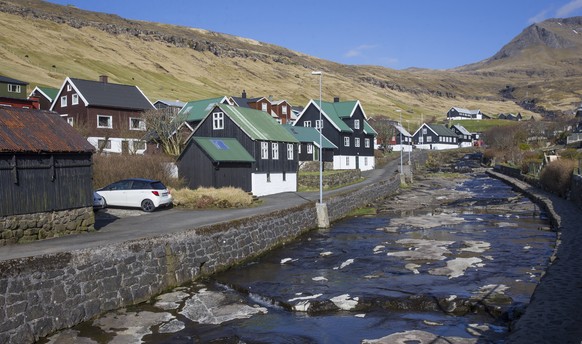 epa08373477 A general view of the the village of Kvivik, Faroe Islands, 20 April 2020 as schools opened again after being closed for five weeks due to the Coronavirus pandemic. Students from first to  ...